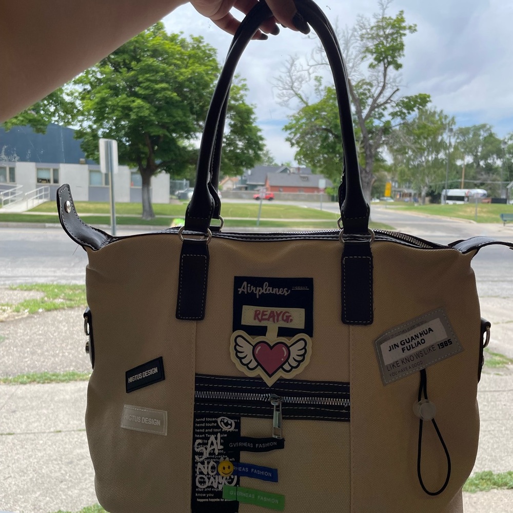 Stylish Beige Tote Bag with Black Accents